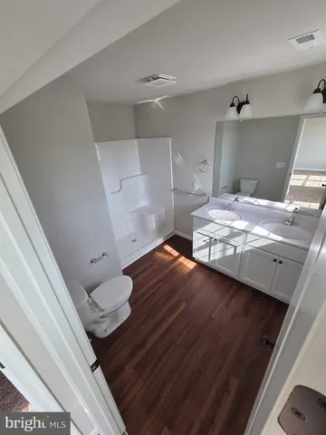 a bedroom with a bed and a cabinets