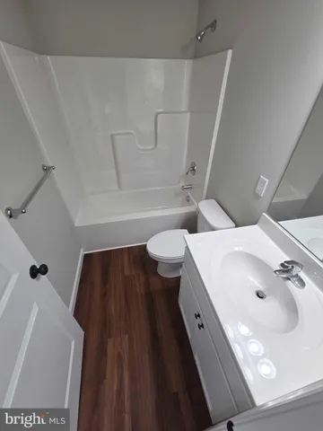 a bathroom with a sink and toilet