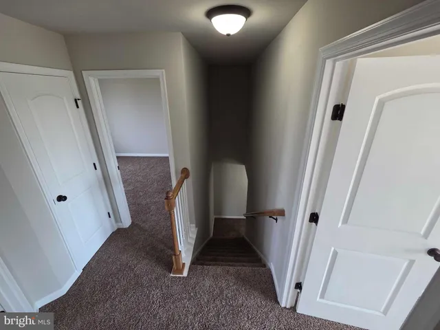 a view of a livingroom from a hallway