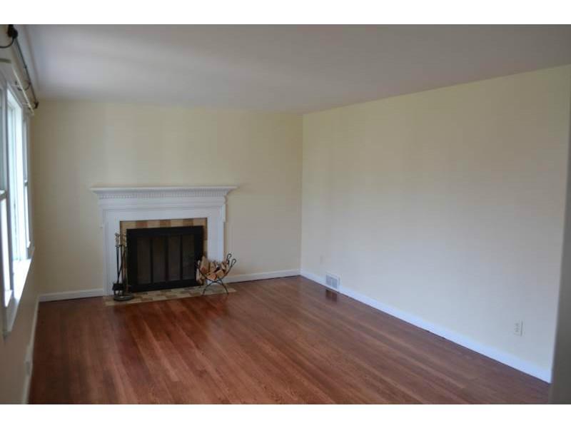 1152 Eckert Road Monaca, PA 15061 - Photo 3 of 16 Living Room. Working wood burning fireplace. Beautifully finished hardwood floors.