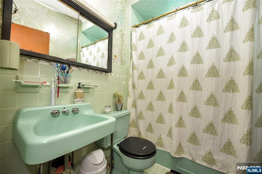 142 South Main Street Hackensack, NJ 07601 - Photo 11 of 33 a bathroom with a sink and a toilet