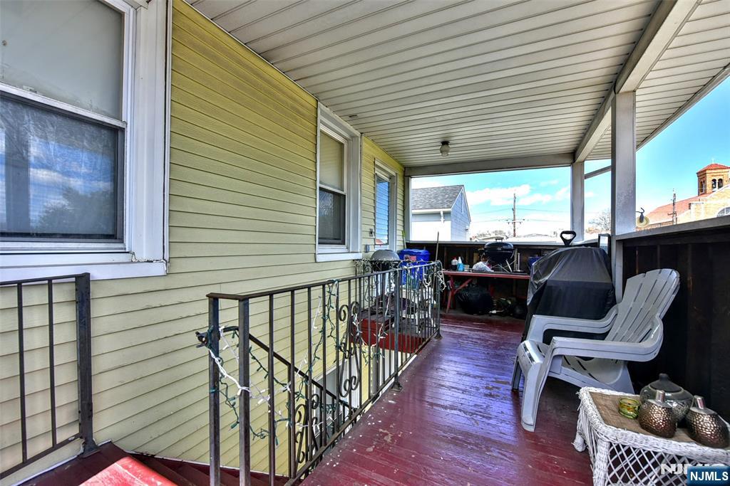 142 South Main Street Hackensack, NJ 07601 - Photo 15 of 33 a balcony with chairs and wooden floor