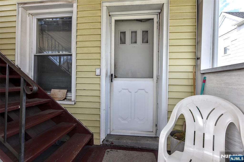 142 South Main Street Hackensack, NJ 07601 - Photo 16 of 33 a view of entryway with wooden floor and stairs