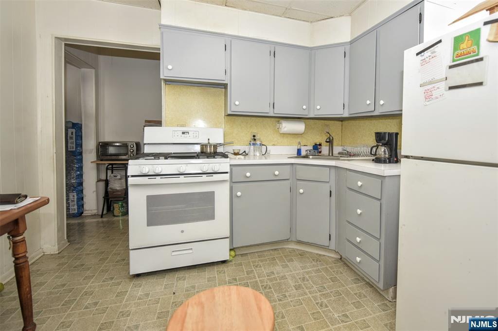 142 South Main Street Hackensack, NJ 07601 - Photo 17 of 33 a kitchen with a stove a sink and a refrigerator