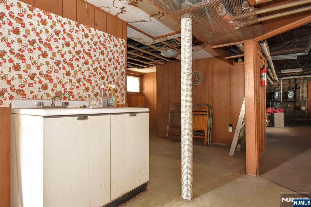 142 South Main Street Hackensack, NJ 07601 - Photo 26 of 33 a view of walk in closet with clothes and shoes
