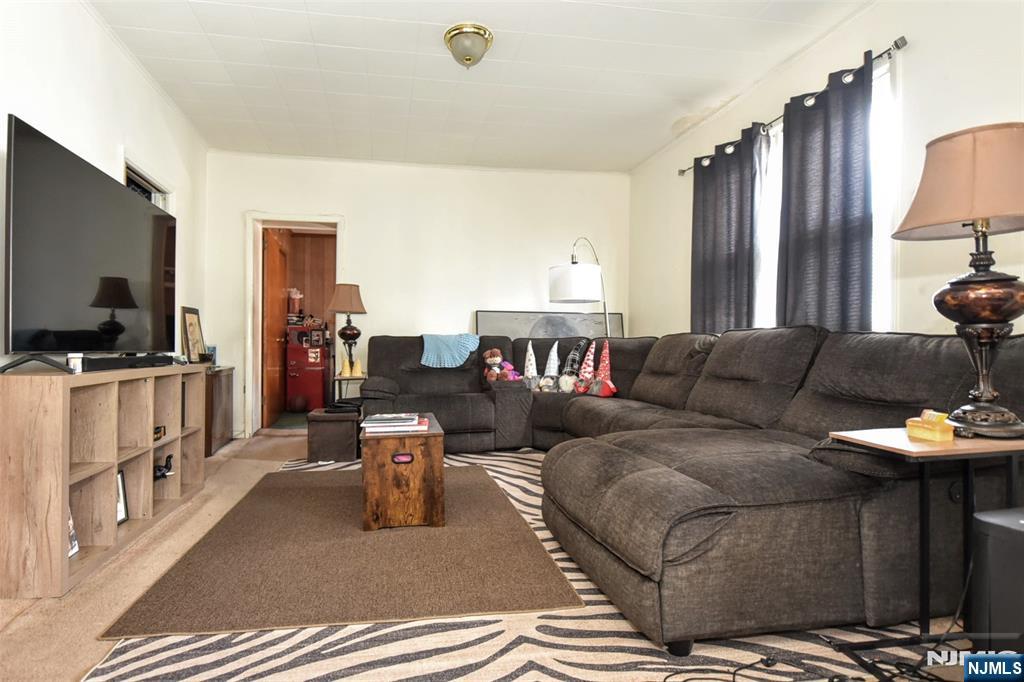 142 South Main Street Hackensack, NJ 07601 - Photo 4 of 33 a living room with furniture and a flat screen tv