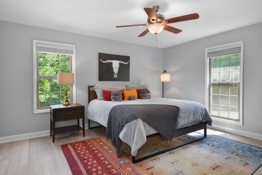 78 Bluebird Lane Blue Ridge, GA 30513 - Photo 12 of 29 a bed room with a bed and a chair