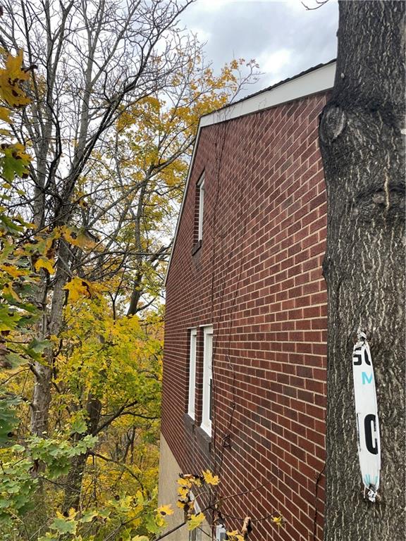 2851 Mt Troy Road Pittsburgh, PA 15212 - Photo 2 of 19 a brick building with a large tree