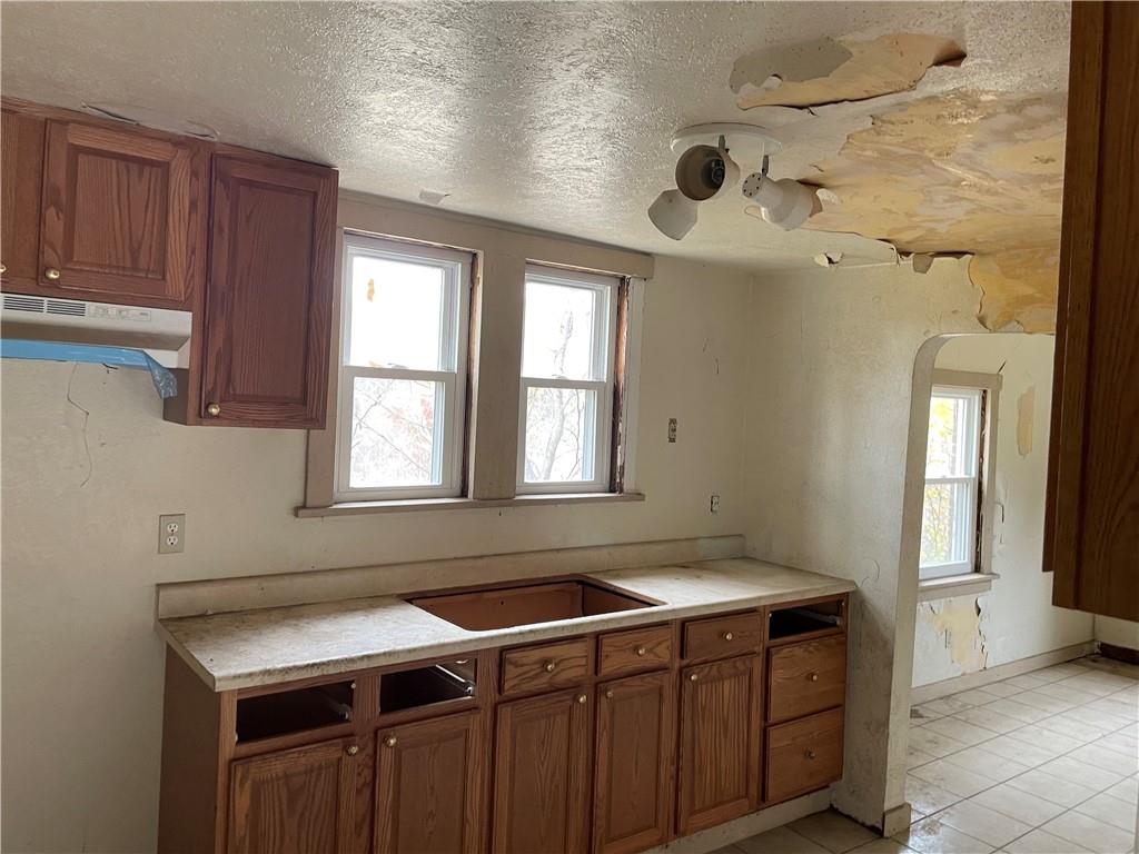 2851 Mt Troy Road Pittsburgh, PA 15212 - Photo 7 of 19 a bathroom with a sink and a window