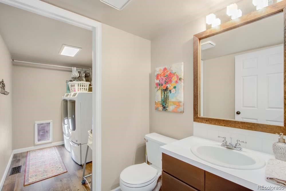 2031 Prairie View Court Fort Collins, CO 80526 - Photo 11 of 33 a bathroom with a sink vanity mirror and toilet