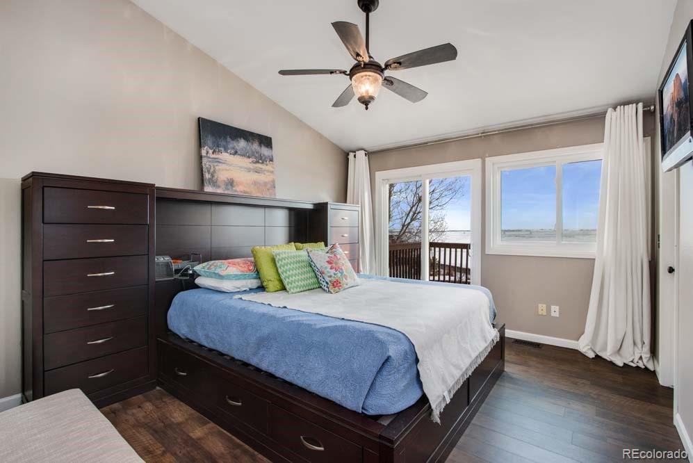 2031 Prairie View Court Fort Collins, CO 80526 - Photo 16 of 33 a bedroom with a bed a chandelier and a window