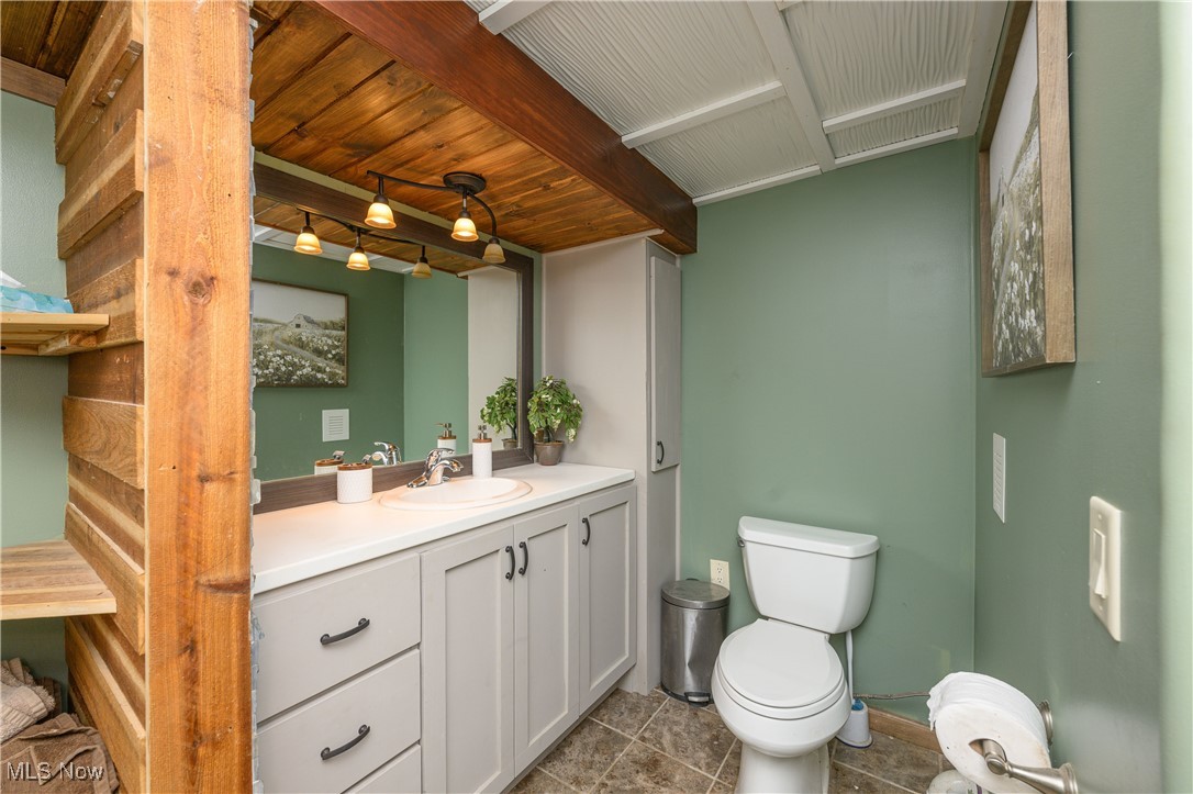 33201 Host Road Bowerston, OH 44695 - Photo 23 of 30 Bathroom featuring vanity, toilet, and tile patterned floors