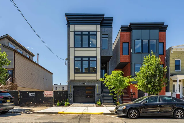 a view of a car parked in front of a building