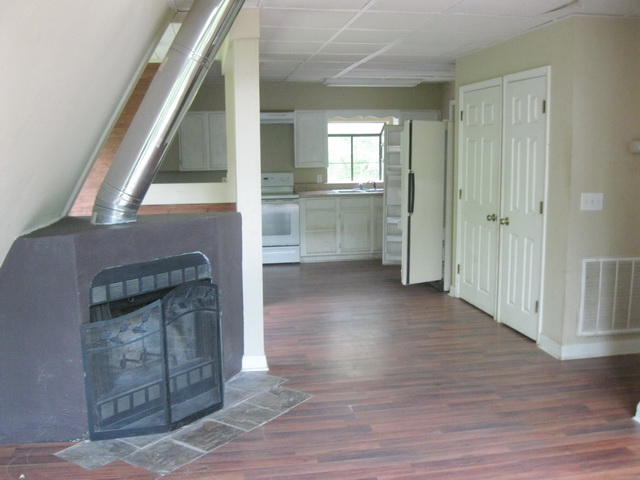 104 Meadowlark Road Blue Ridge, VA 24064 - Photo 14 of 19 a view of a hallway with wooden floor staircase and a living room