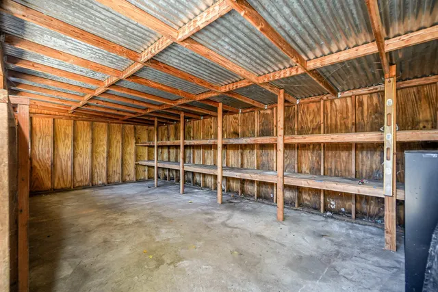 a view of a chairs and table in a patio