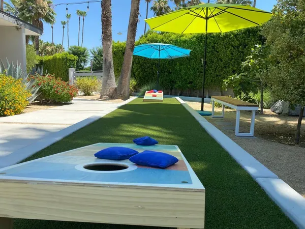 a view of a backyard with sitting area