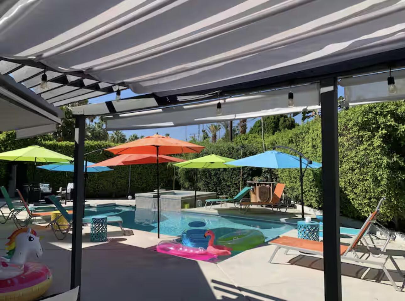 1375 South Calle Rolph Palm Springs, CA 92264 - Photo 11 of 19 a view of the patio with a table and chairs under an umbrella