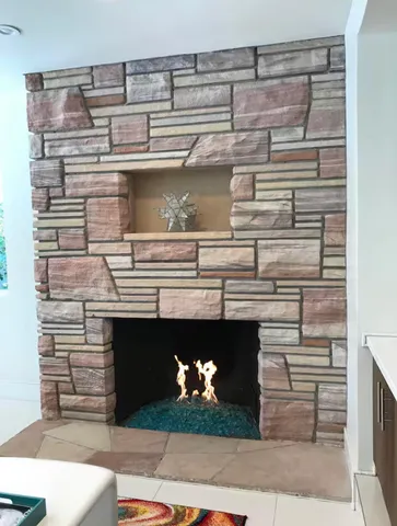 a view of a house with a swimming pool and sitting area