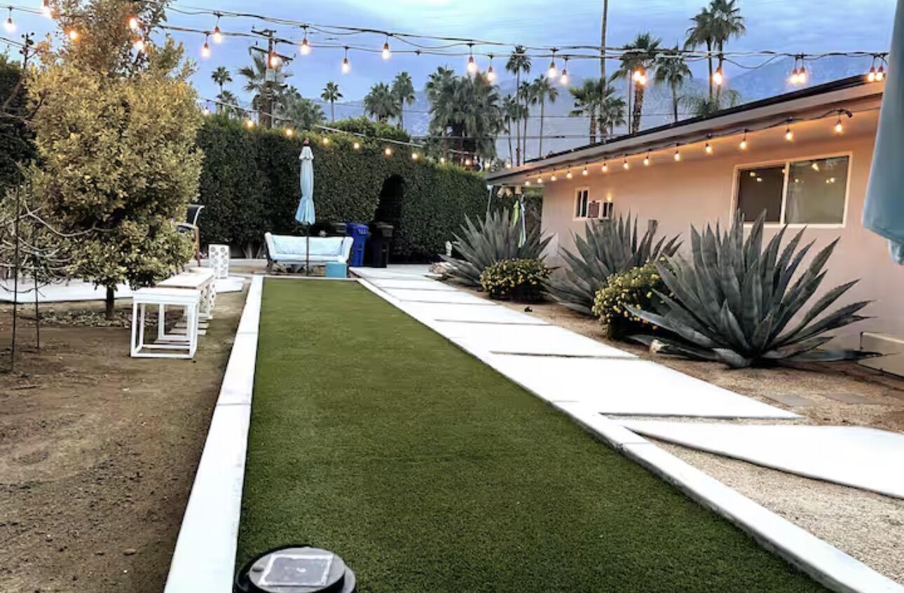 1375 South Calle Rolph Palm Springs, CA 92264 - Photo 2 of 19 a view of a swimming pool with a lounge chairs