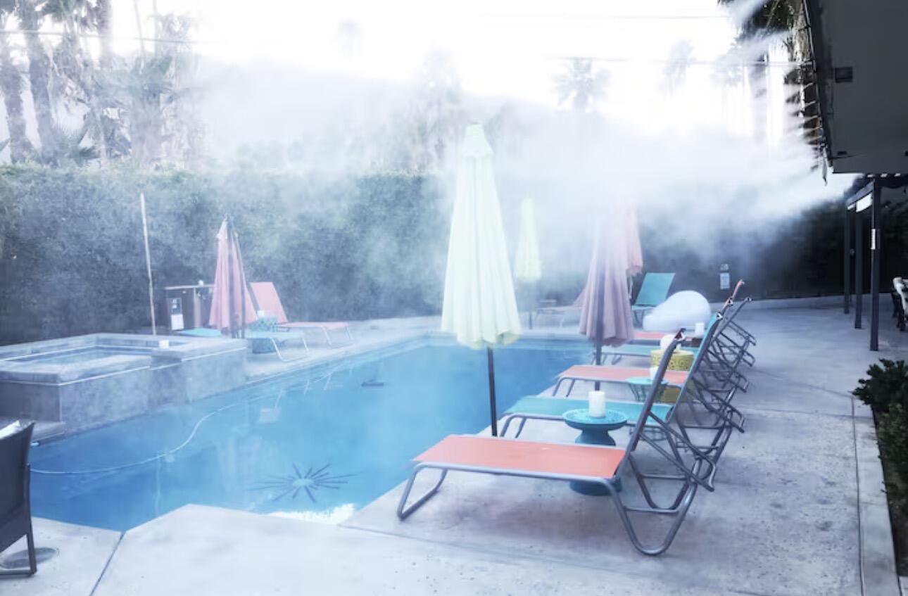 1375 South Calle Rolph Palm Springs, CA 92264 - Photo 8 of 19 a backyard of a house with table and chairs