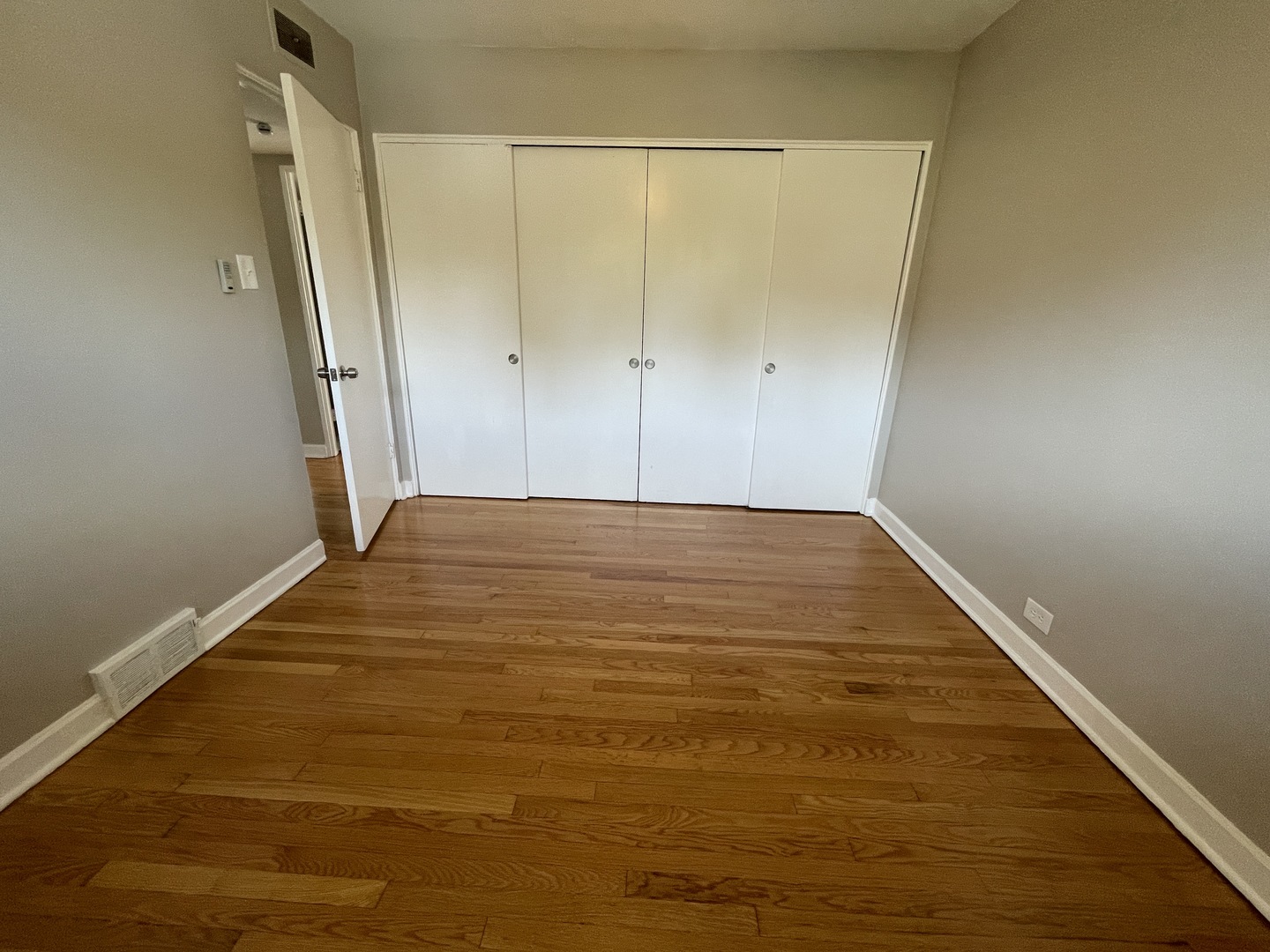 1605 Monroe Street, Unit 1 Evanston, IL 60202 - Photo 12 of 14 a view of a big room with wooden floor and brick walls