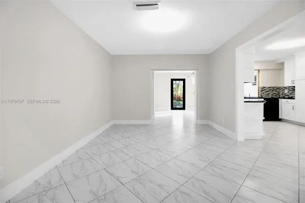 a view of room with window and ceiling fan