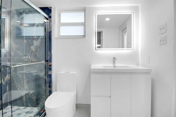a bathroom with a shower and a toilet