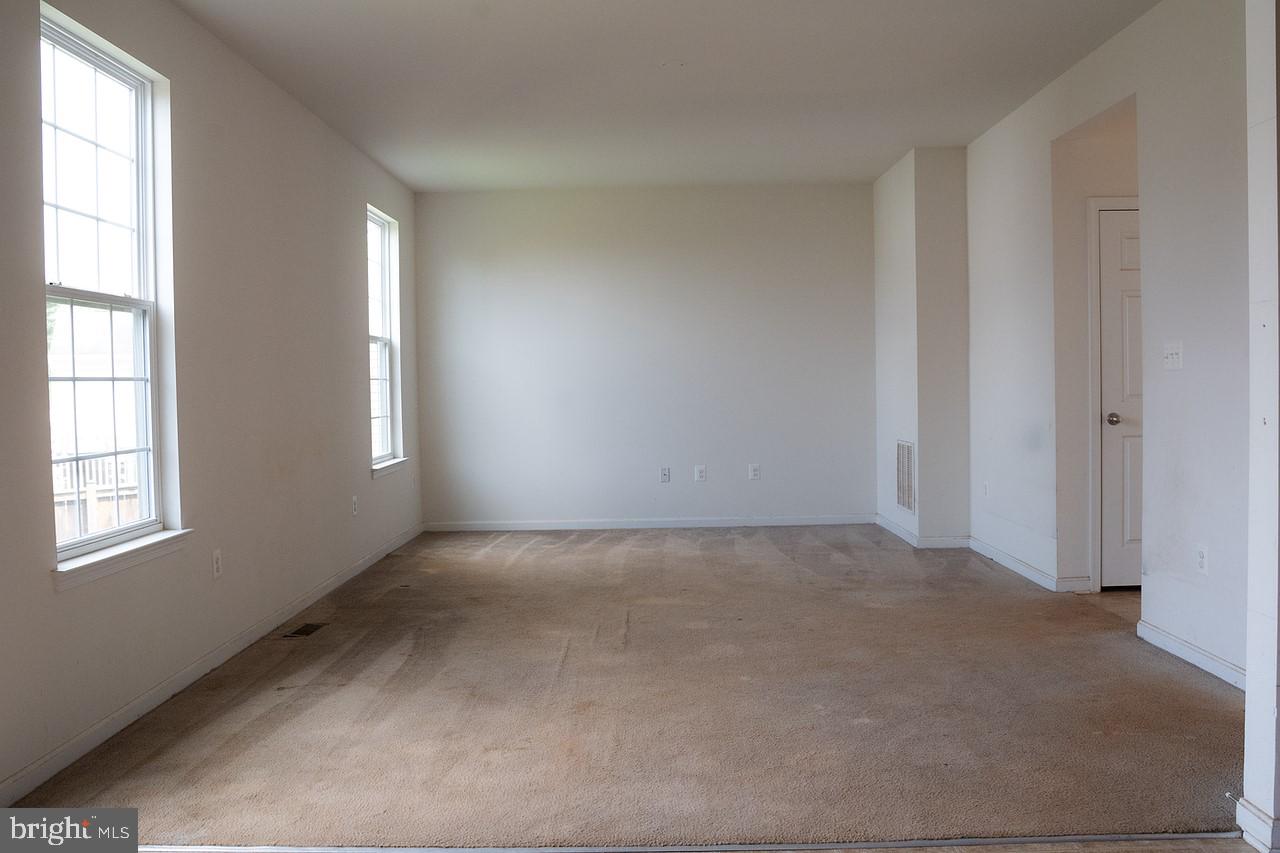 608 Hunters Road Culpeper, VA 22701 - Photo 3 of 30 an empty room with windows