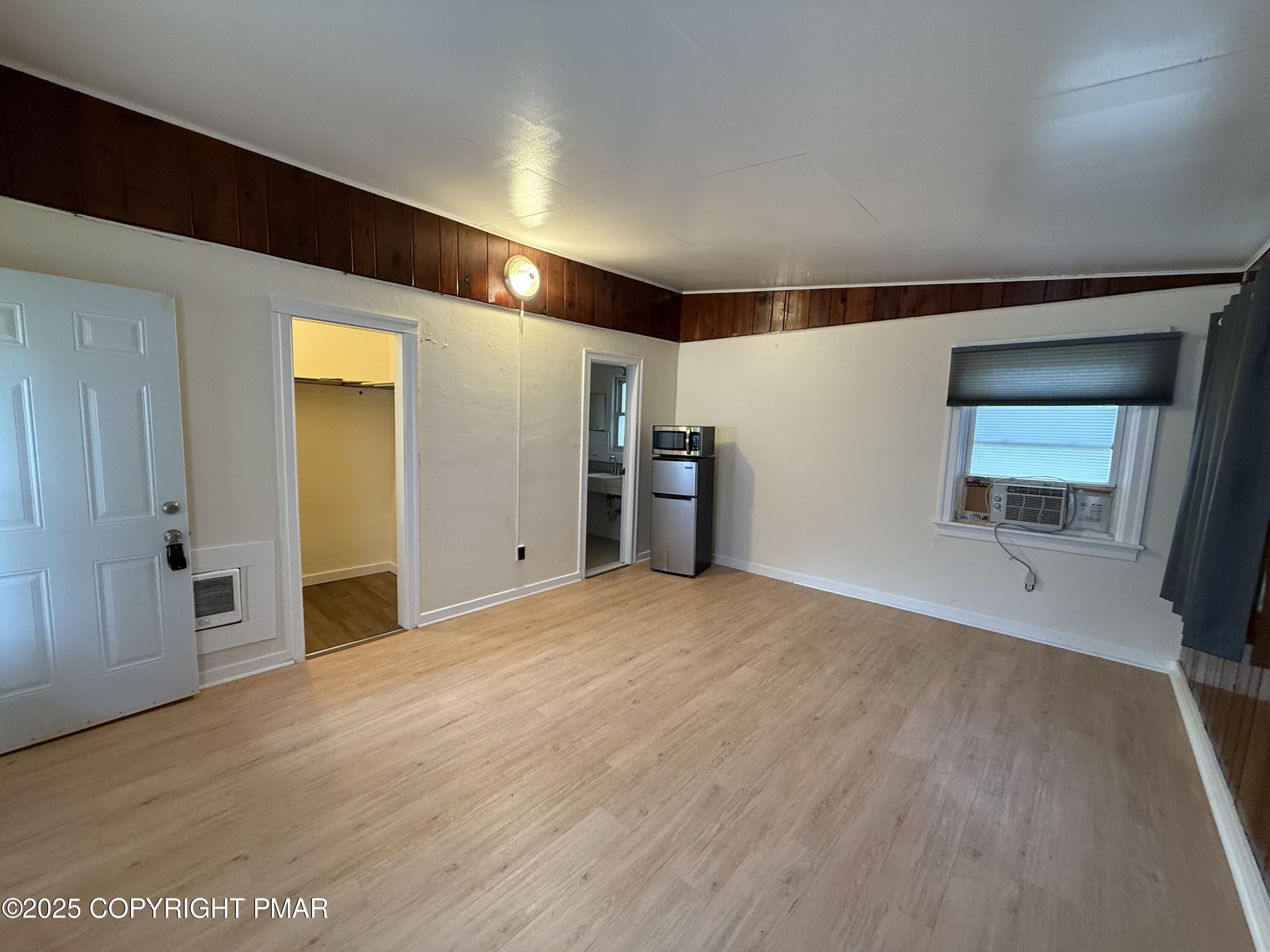 3121 Oak Grove Drive East Stroudsburg, PA 18302 - Photo 2 of 8 a view of empty room with wooden floor