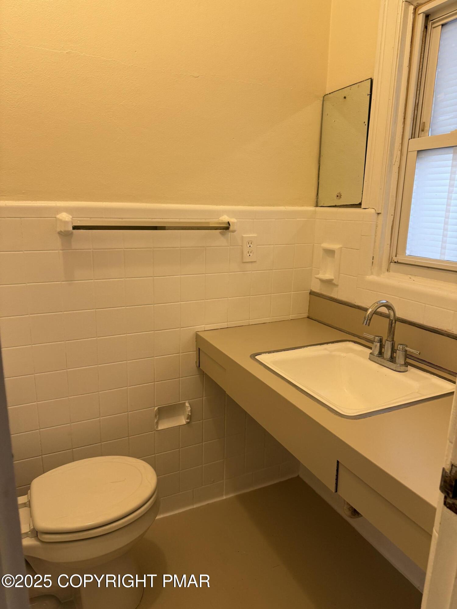 3121 Oak Grove Drive East Stroudsburg, PA 18302 - Photo 3 of 8 a bathroom with a toilet and a sink