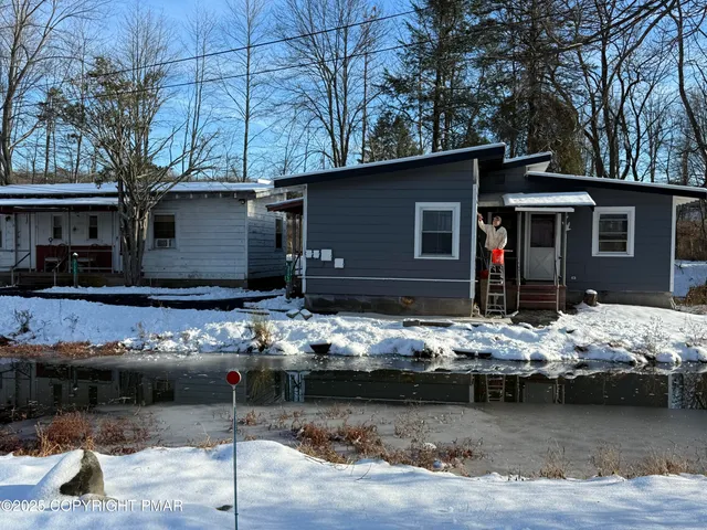 a view of a house with chair and sitting area