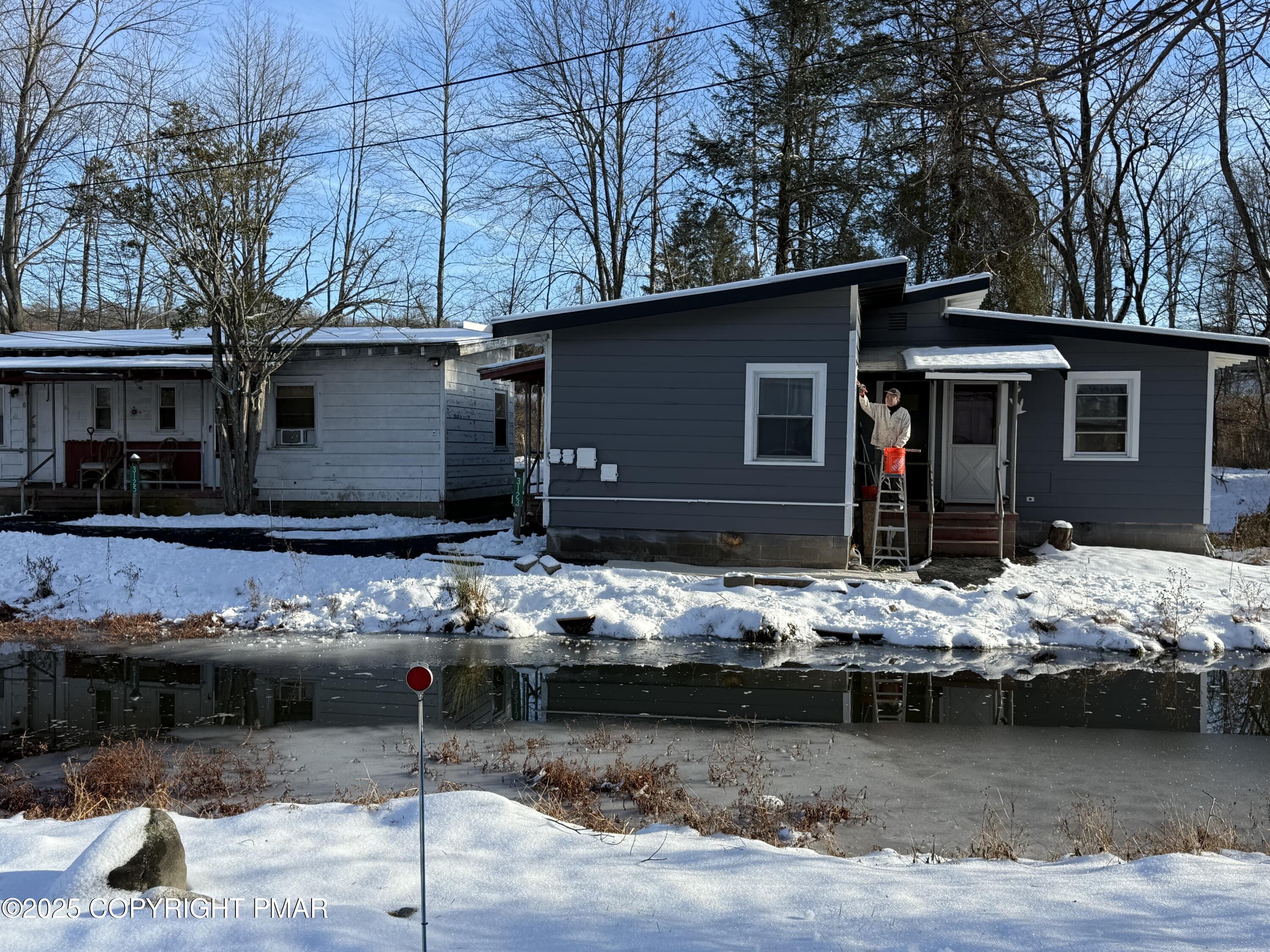 3121 Oak Grove Drive East Stroudsburg, PA 18302 - Photo 7 of 8 a view of a house with chair and sitting area
