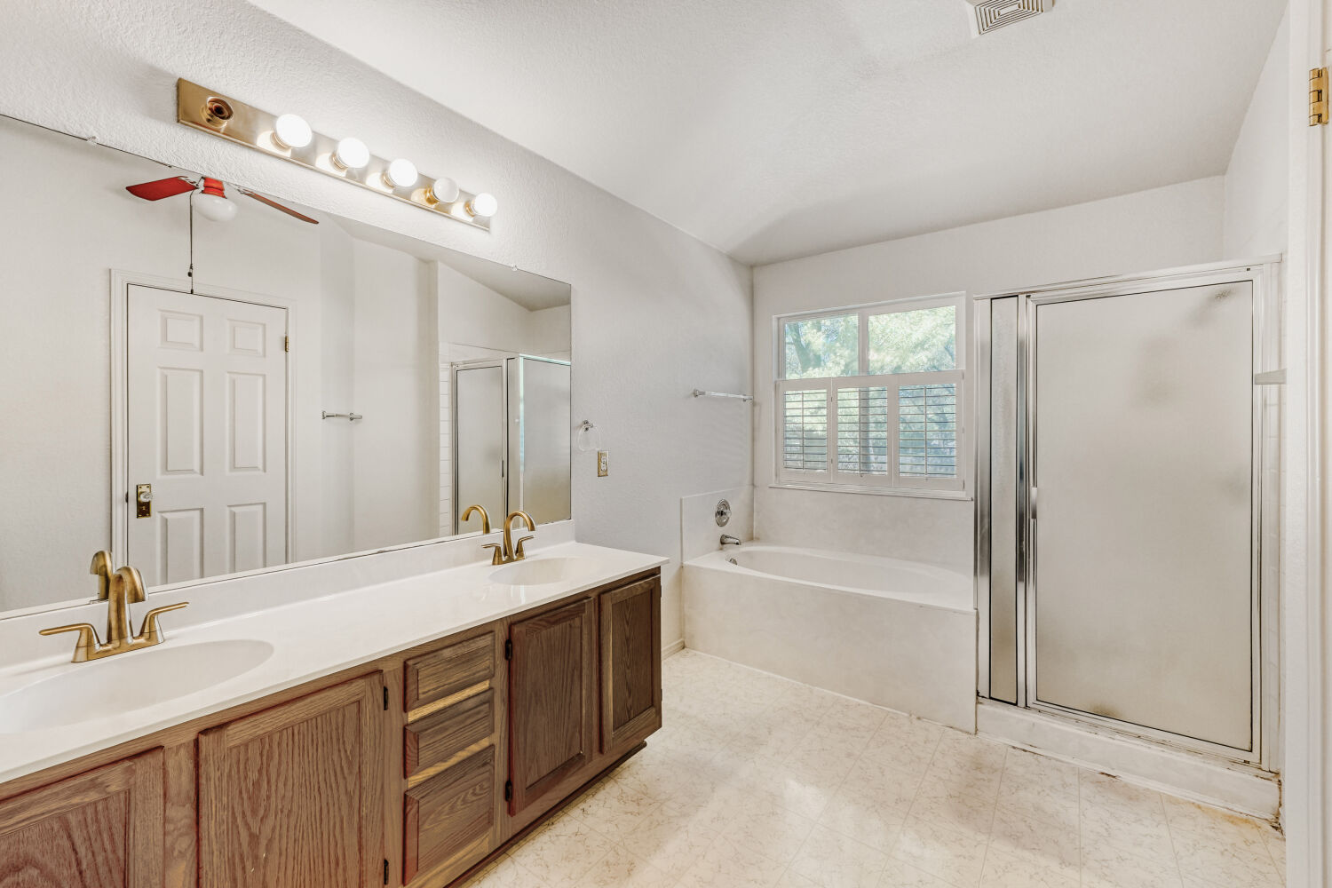 1205 Machado Road Cedar Park, TX 78613 - Photo 21 of 30 a spacious bathroom with a tub sink and mirror