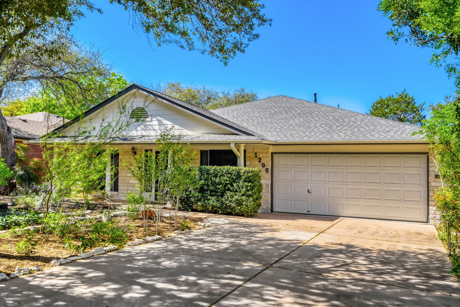 1205 Machado Road Cedar Park, TX 78613 - Photo 3 of 30 a front view of a house with a yard and garage