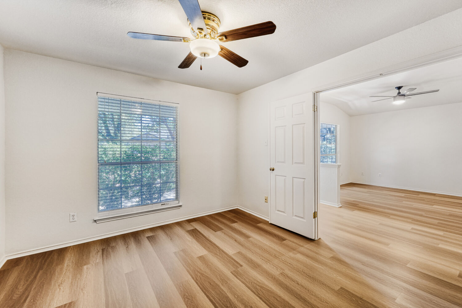 1205 Machado Road Cedar Park, TX 78613 - Photo 5 of 30 wooden floor in an empty room with a window