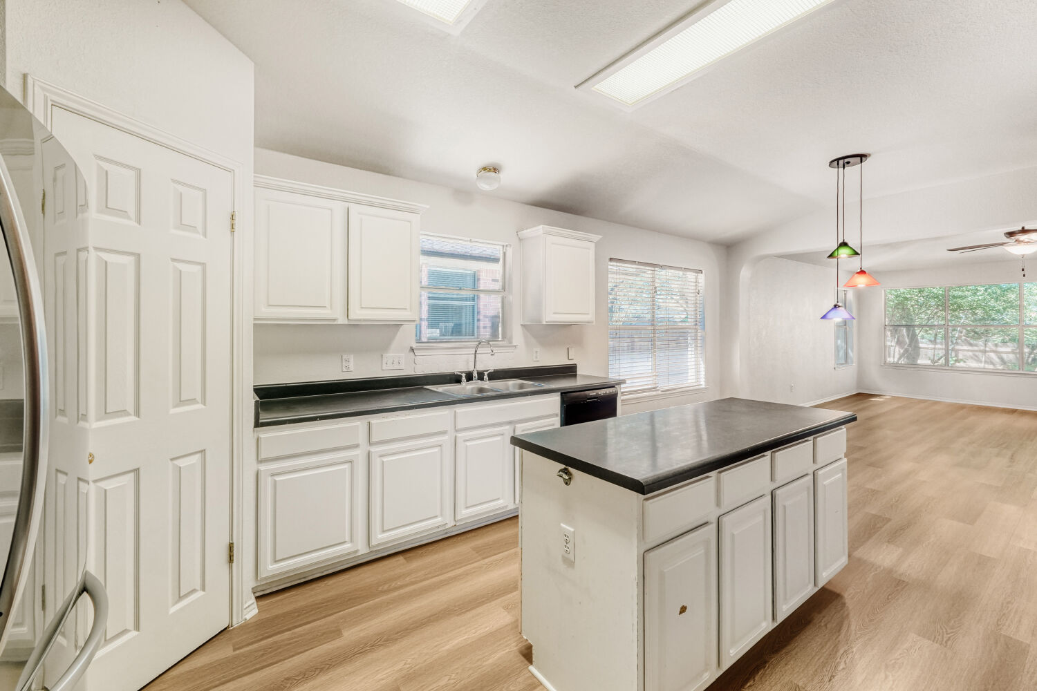 1205 Machado Road Cedar Park, TX 78613 - Photo 10 of 30 a kitchen with stainless steel appliances granite countertop a sink window and cabinets