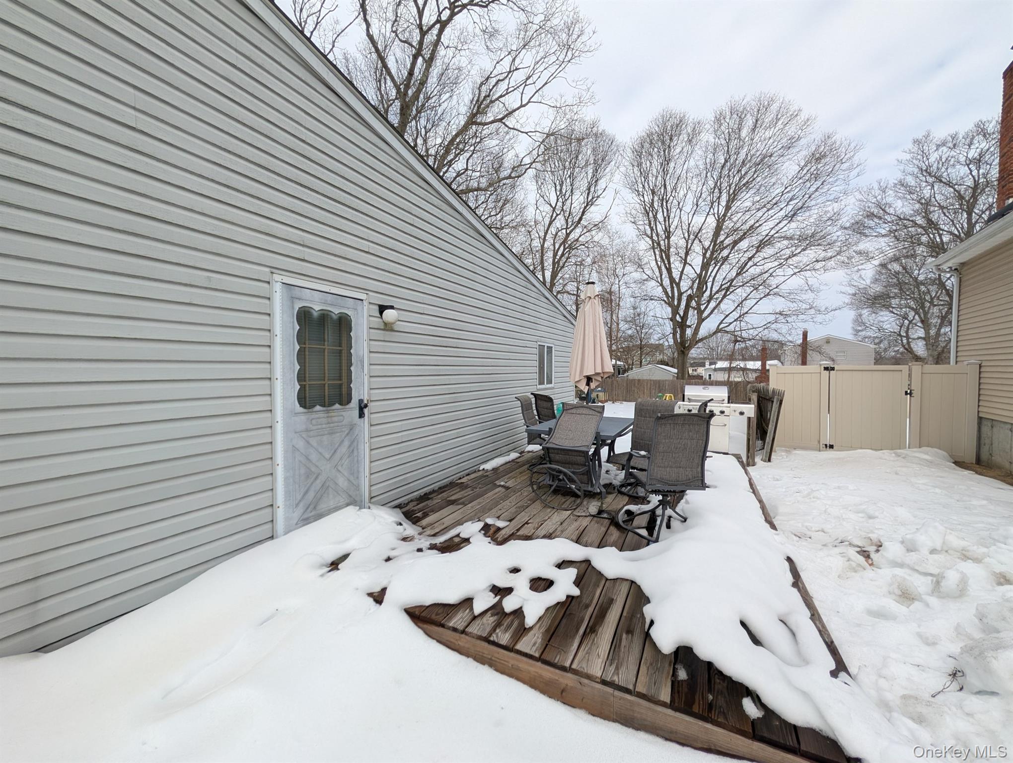 17 Oneida Avenue Selden, NY 11784 - Photo 11 of 12 a view of a patio with a table and chairs