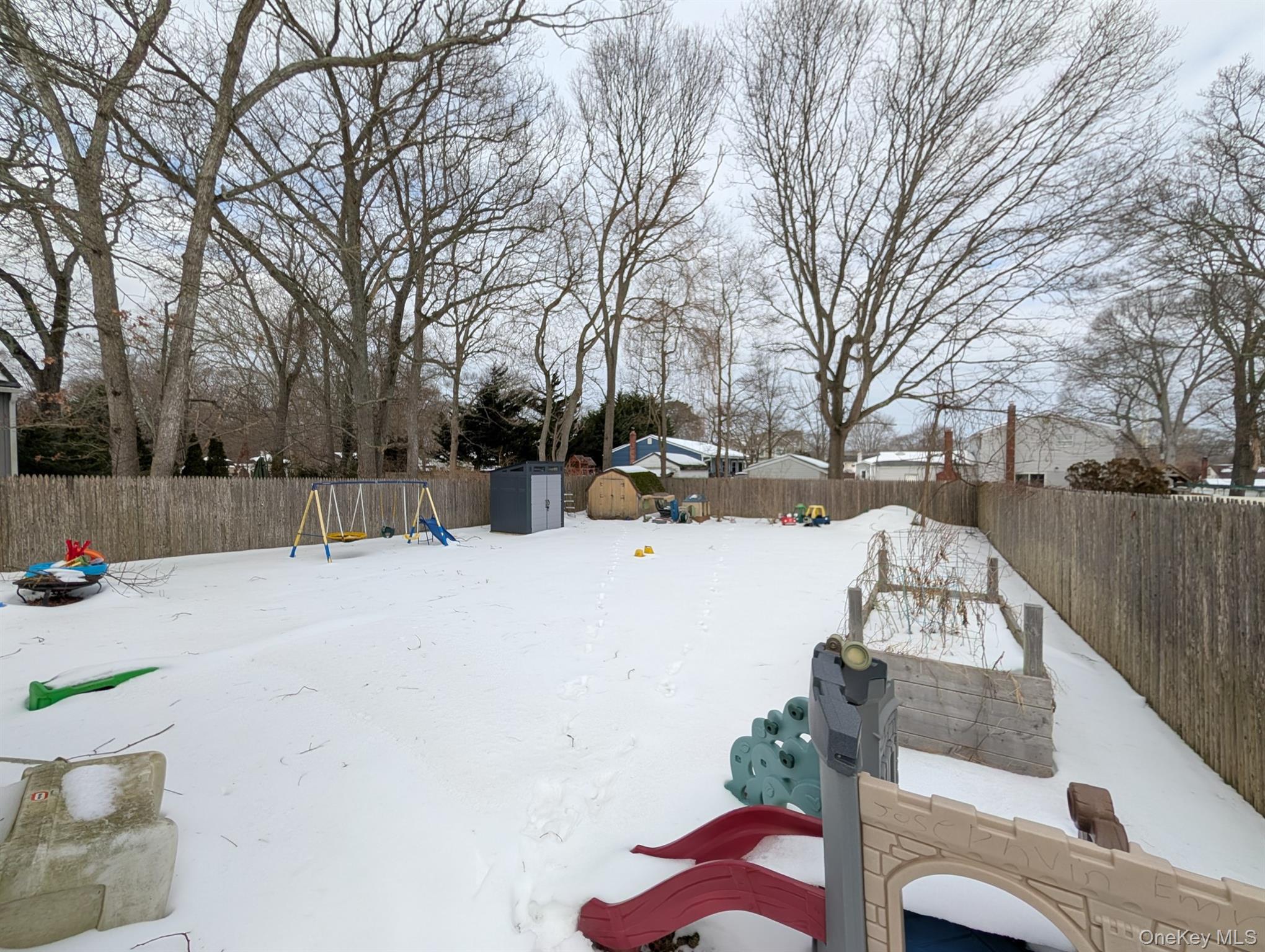 17 Oneida Avenue Selden, NY 11784 - Photo 12 of 12 a view of outdoor space with wooden fence