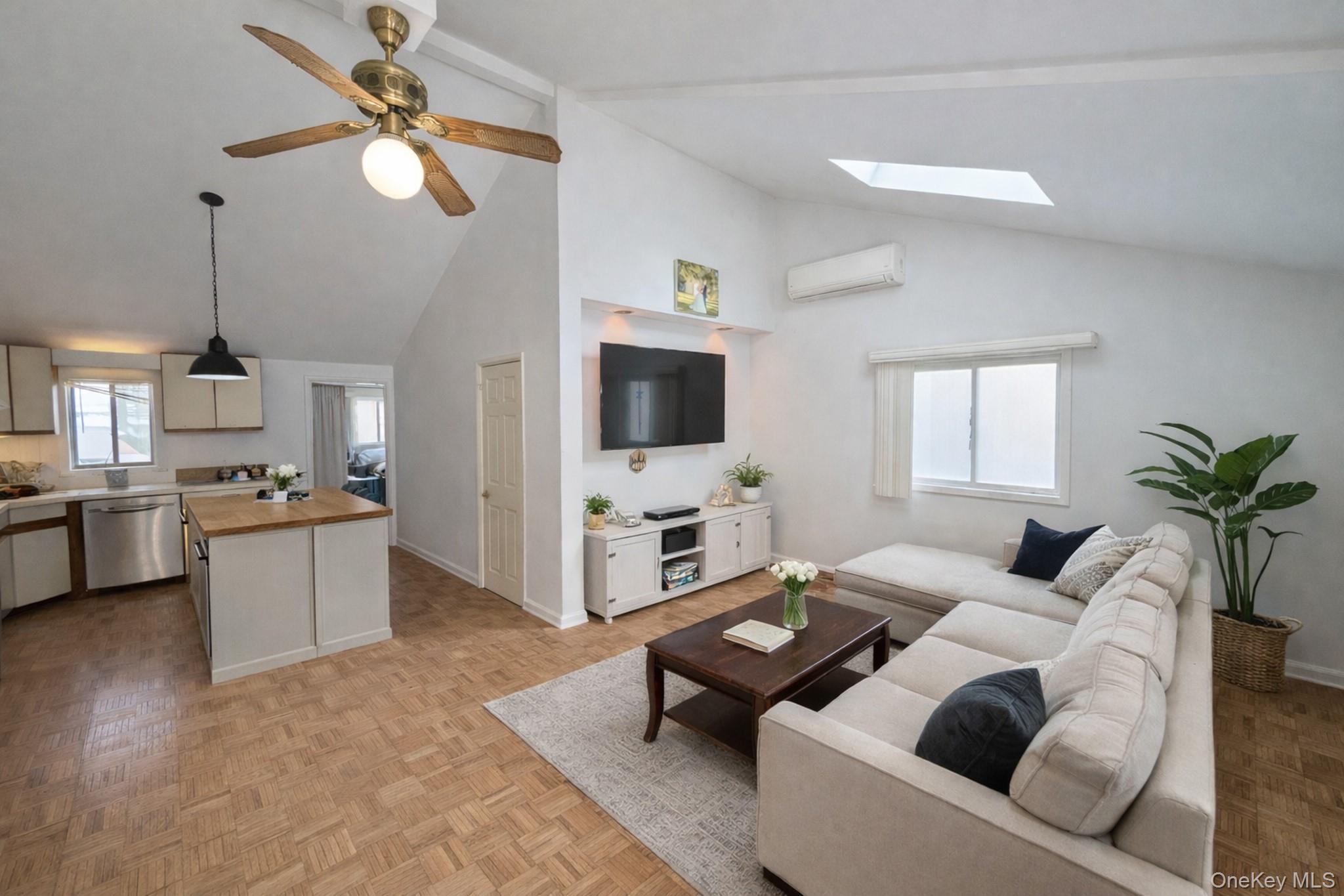 17 Oneida Avenue Selden, NY 11784 - Photo 4 of 12 a living room with furniture and a flat screen tv