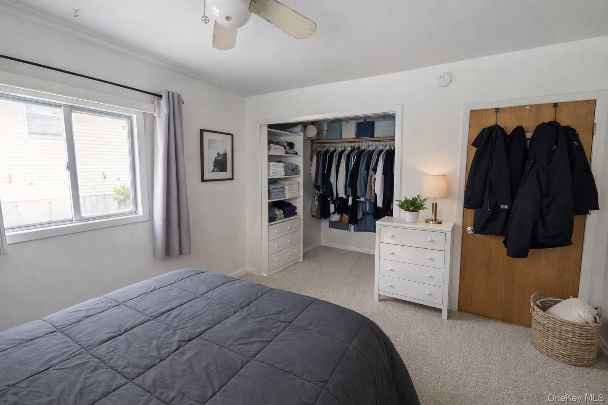17 Oneida Avenue Selden, NY 11784 - Photo 7 of 12 a bedroom with a bed and a closet