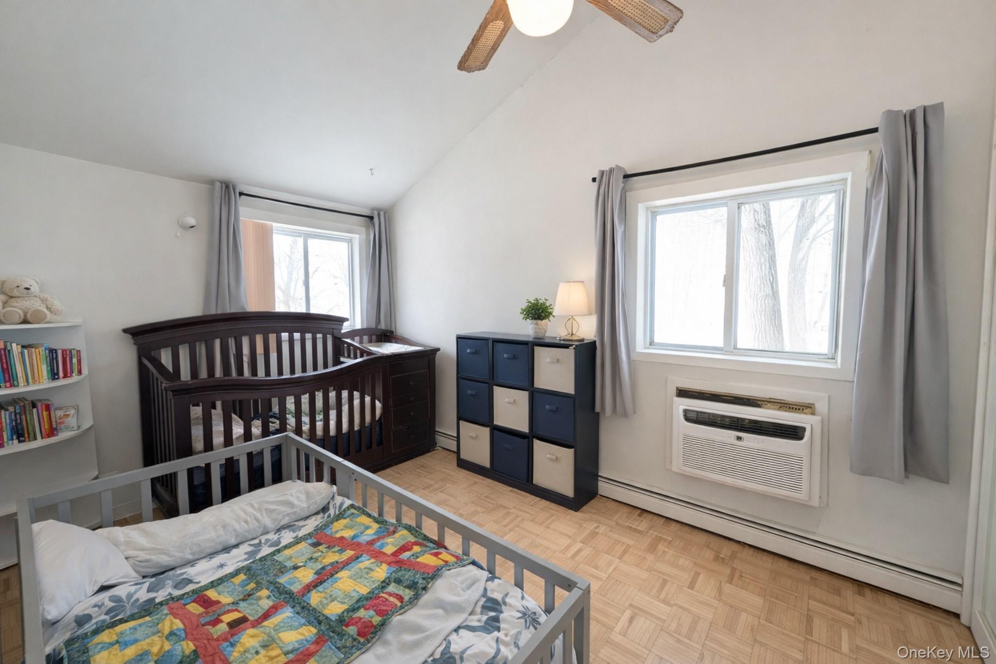 17 Oneida Avenue Selden, NY 11784 - Photo 8 of 12 a bedroom with a bed and a window