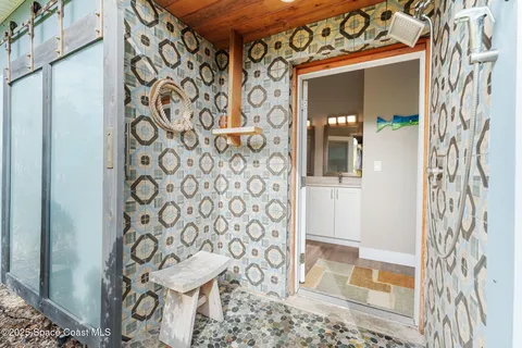 a bathroom with a double vanity sink toilet mirror and shower