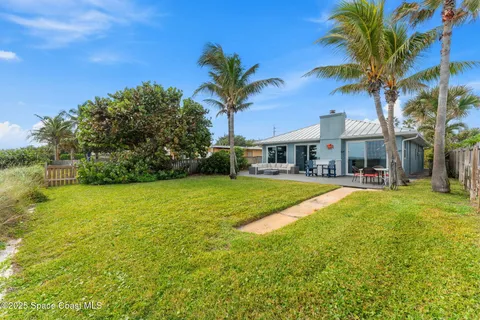a house with swimming pool in front of it