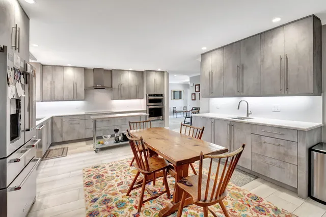 a bedroom with a bed and a table in it