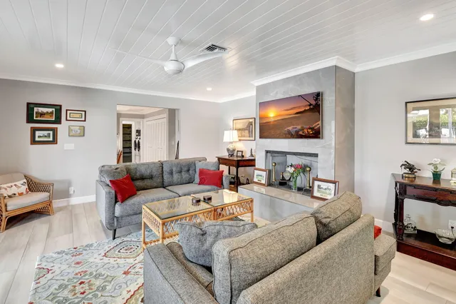 a bedroom with a bed a couch and dresser