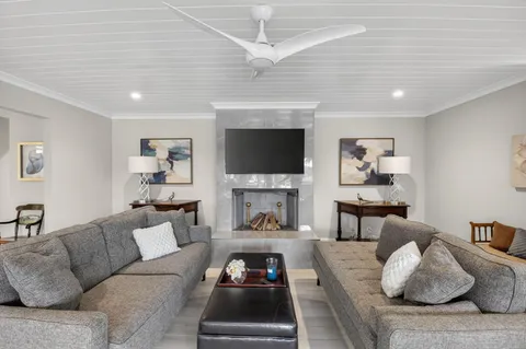 an aerial view of residential houses with outdoor space and street view