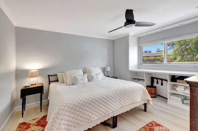 a bathroom with a granite countertop sink and a large mirror