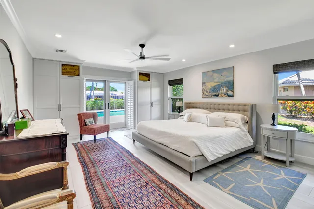 a living room with furniture a rug and a flat screen tv