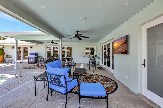 an aerial view of residential houses with outdoor space and street view