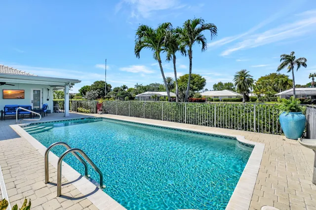 an aerial view of a house with a yard and garden